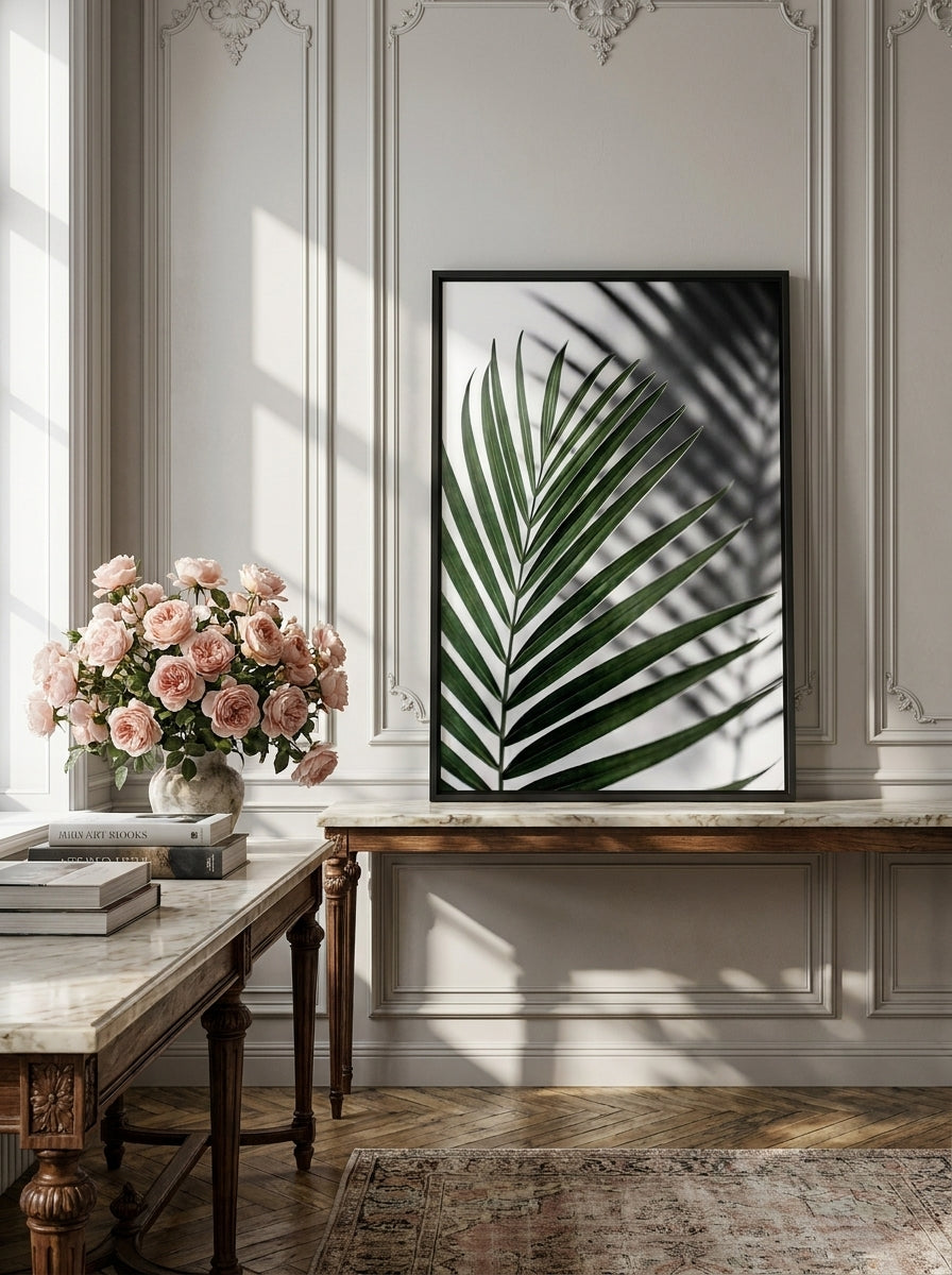 Canvas wall art with a black surround standing on a console in a Parisian bathroom