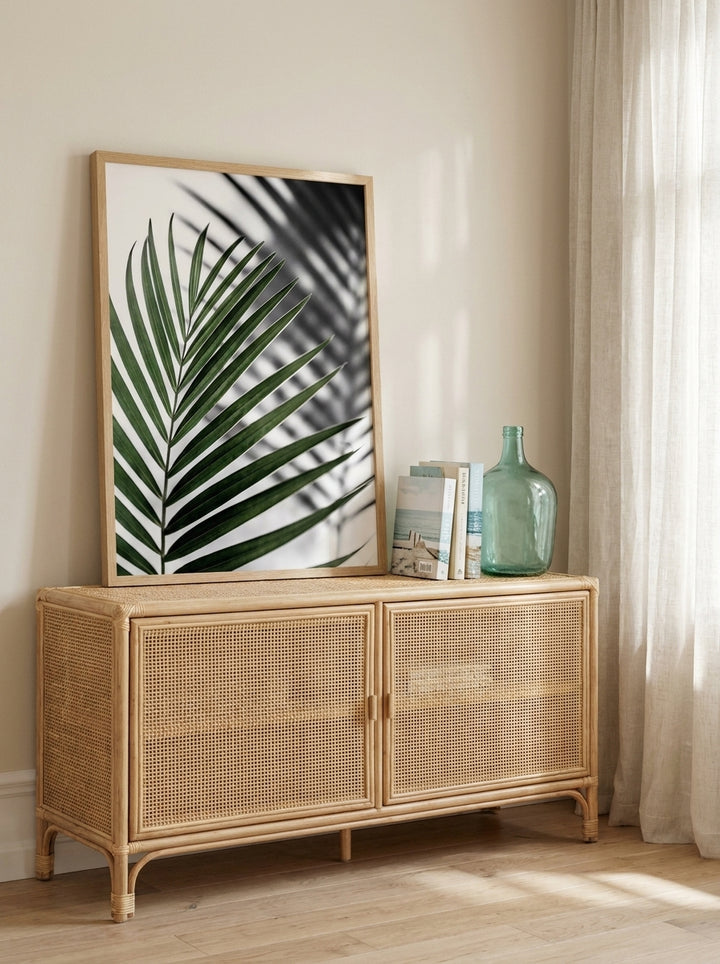 Modern wall art print standing on a sideboard in a coastal home office