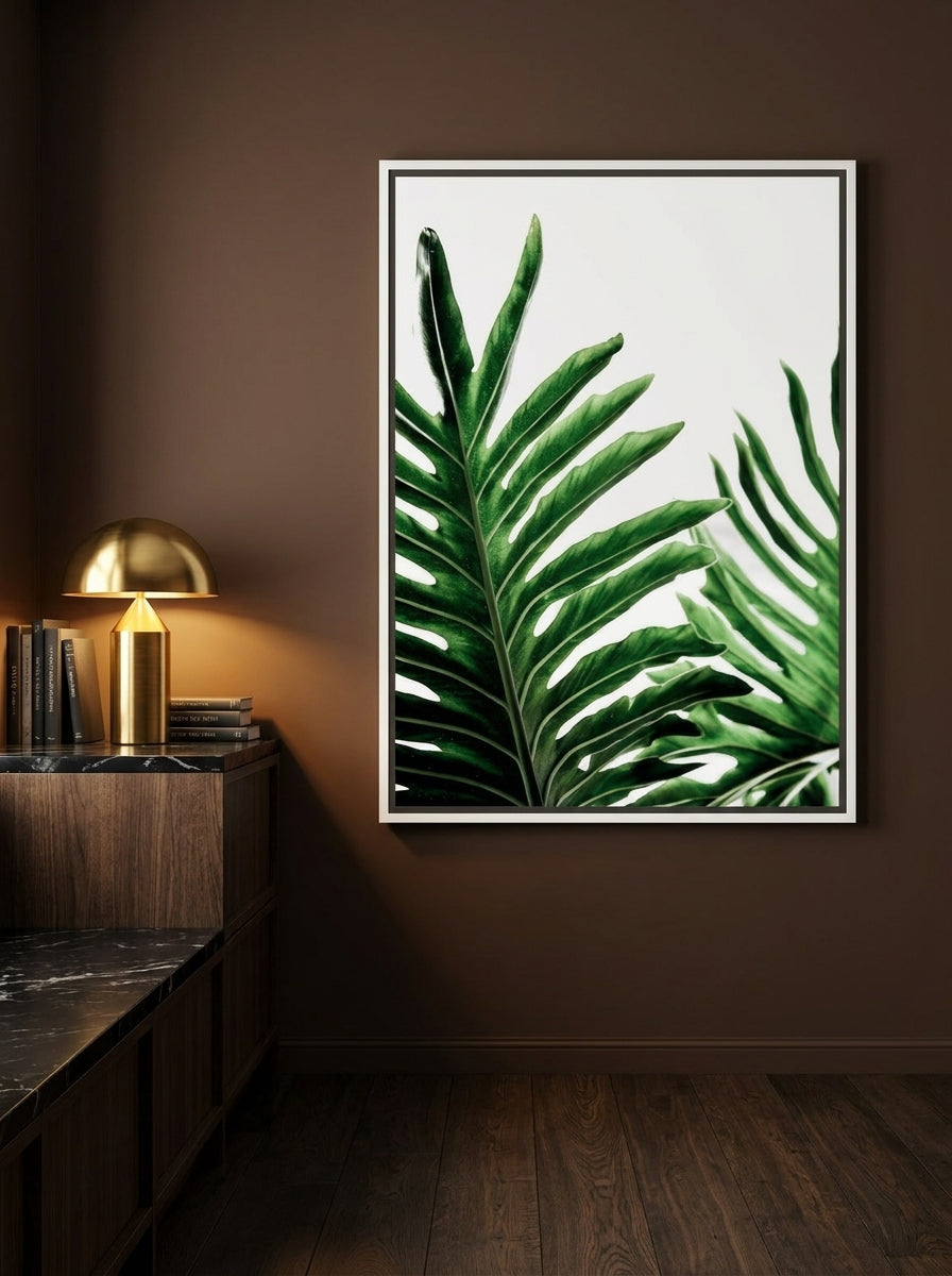 Canvas wall art with a white surround styled on the wall in a moody kitchen