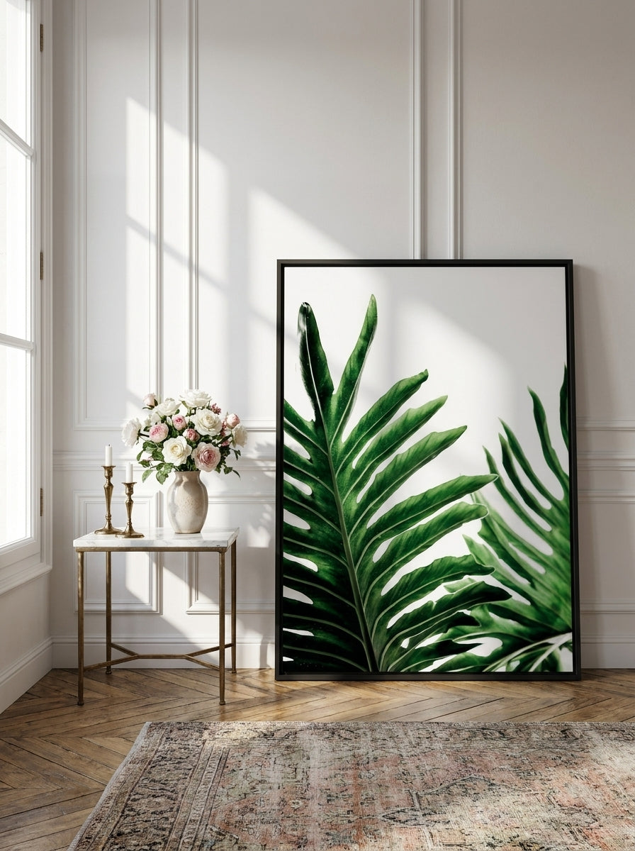 Canvas wall art with a black surround leaning against the wall in a Parisian bathroom