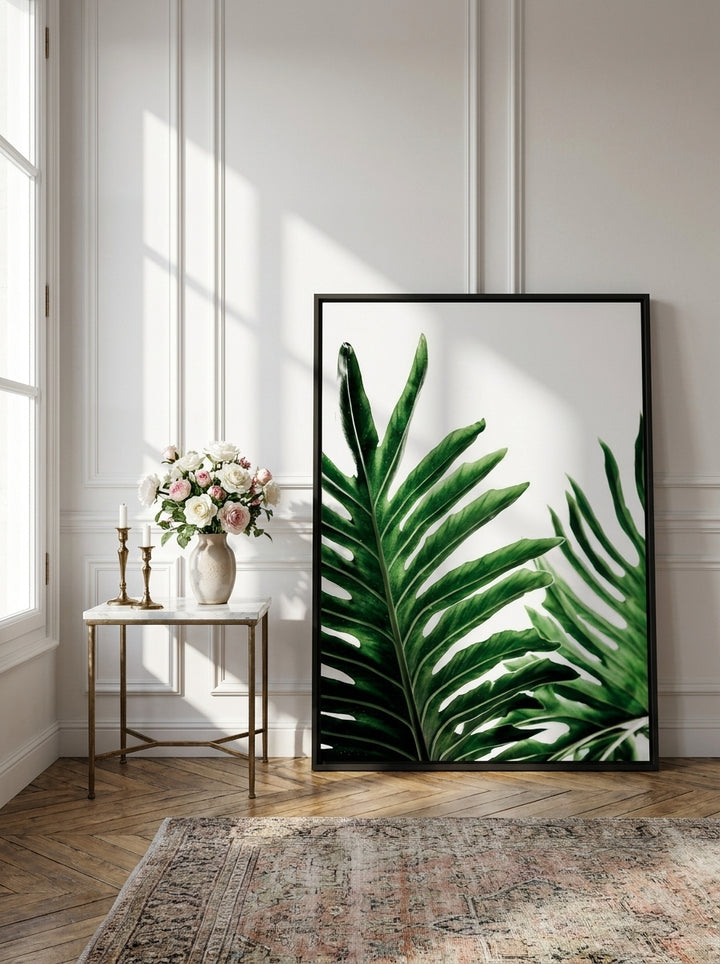Canvas wall art with a black surround leaning against the wall in a Parisian bathroom