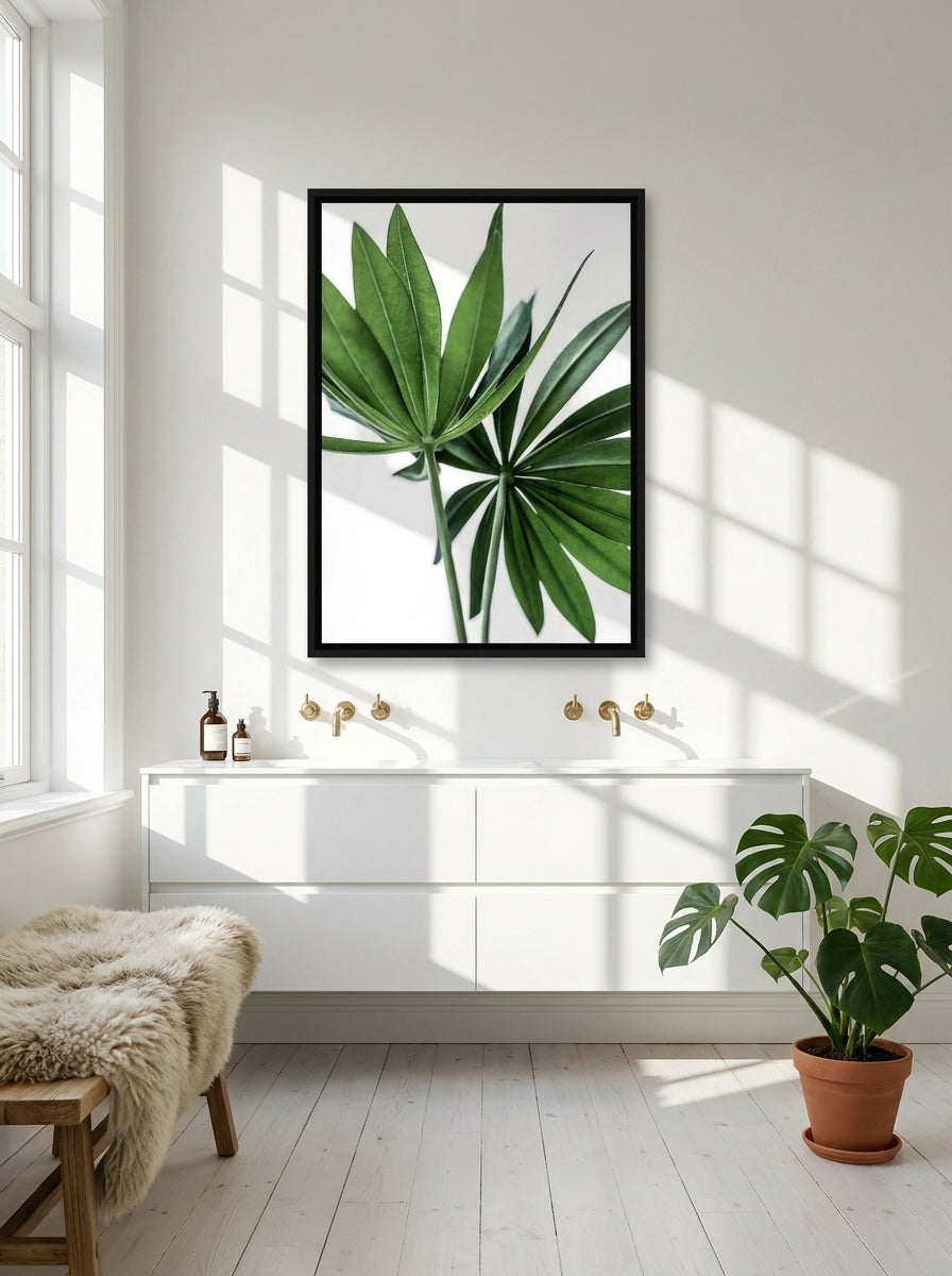 Canvas wall art with a black surround styled on the wall in a bright Scandinavian bathroom