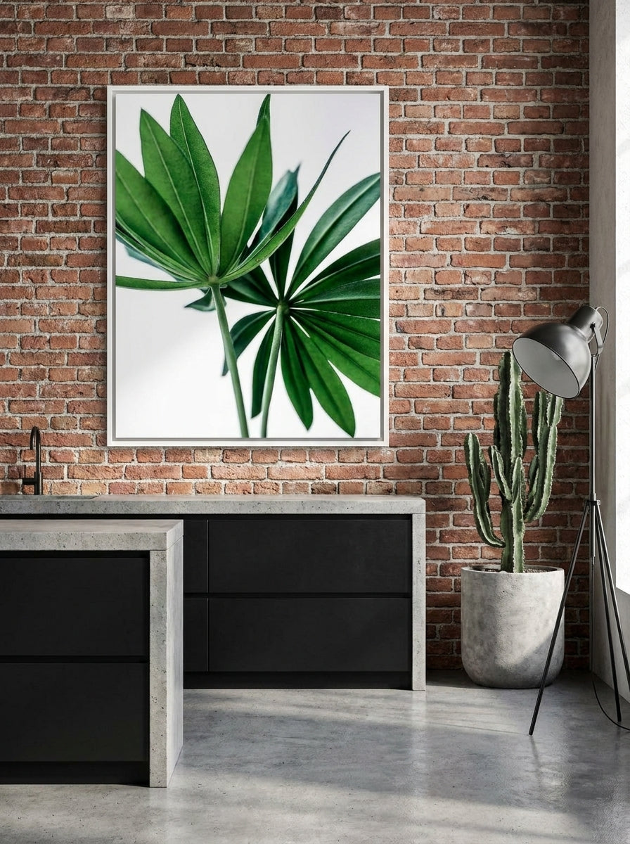 Canvas wall art with a white surround styled on the wall in an industrial loft kitchen
