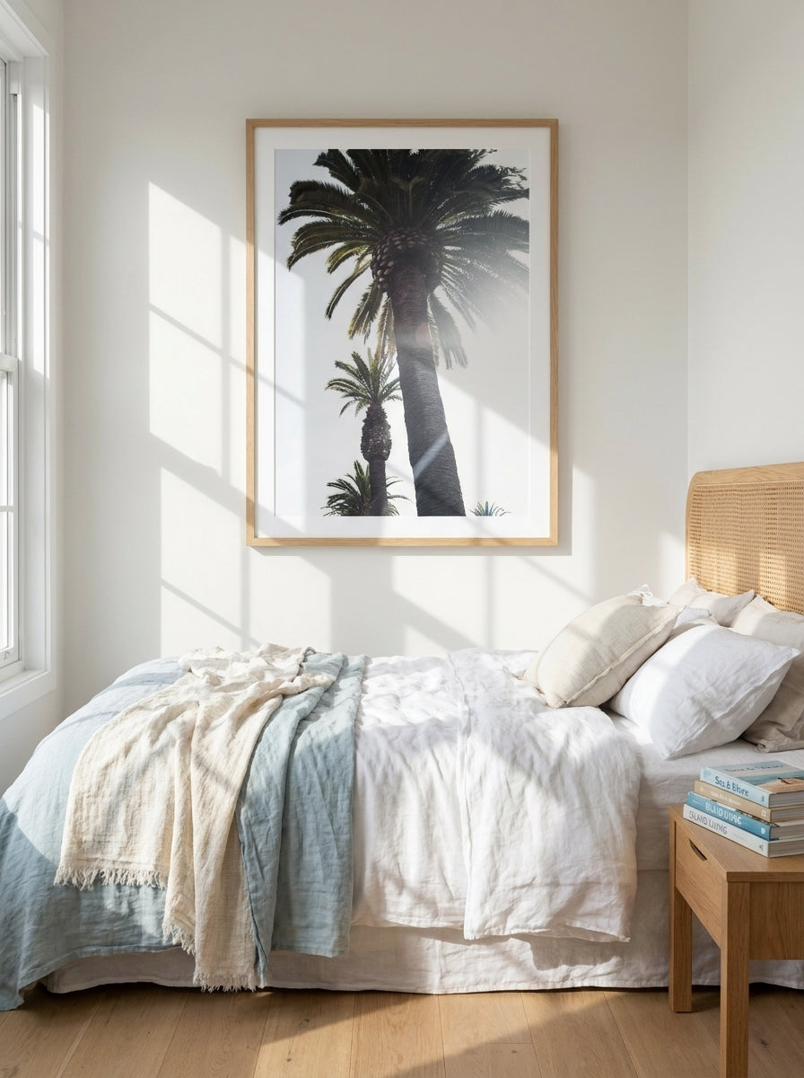 Modern wall art print styled on the wall in a coastal bedroom