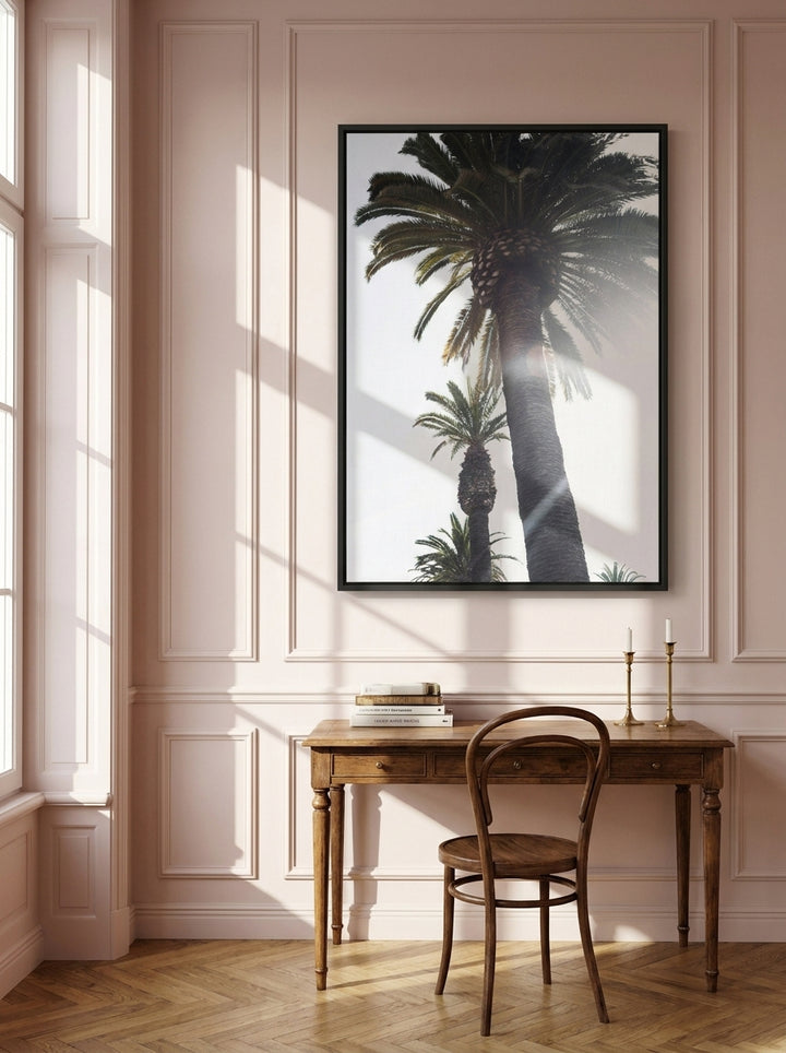 Canvas wall art with a black surround styled on the wall in a Parisian home office