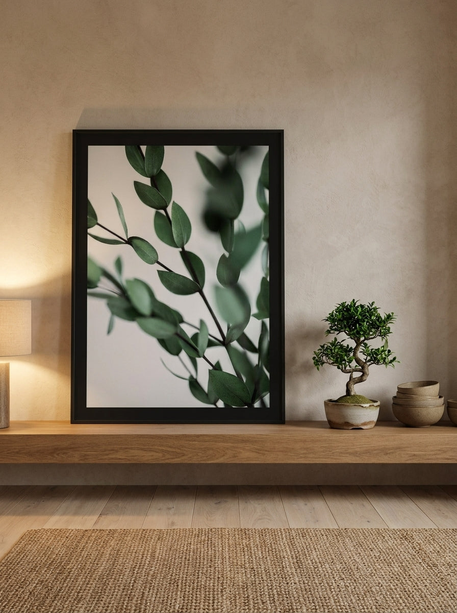 Modern wall art print standing on a shelf in a warm Japandi bathroom
