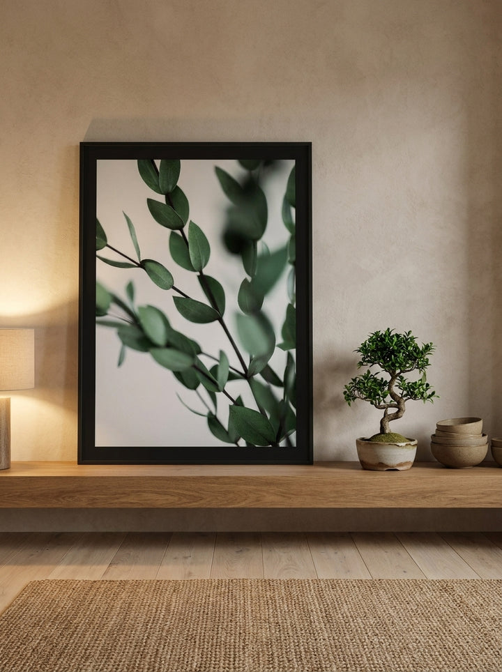 Modern wall art print standing on a shelf in a warm Japandi bathroom