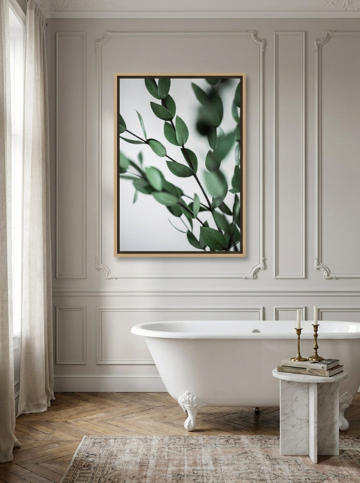 Canvas wall art with a natural timber surround styled on the wall in a Parisian bathroom