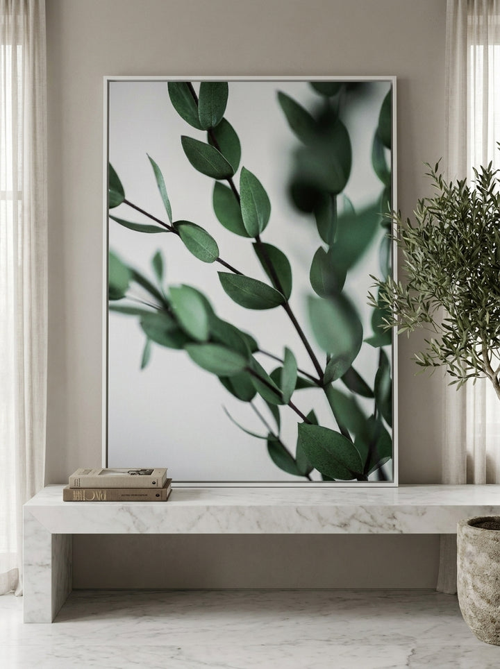 Canvas wall art with a white surround standing on a kitchen bench in a luxe kitchen