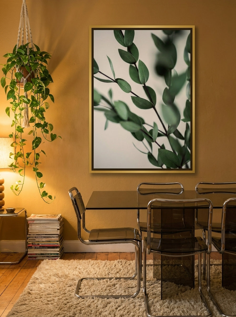 Oversized statement canvas wall art with a gold leaf surround styled on the wall in a retro 70s dining room