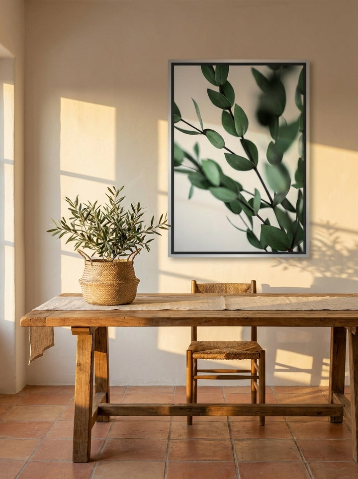 Canvas wall art with a silver leaf surround styled on the wall in a Mediterranean home office