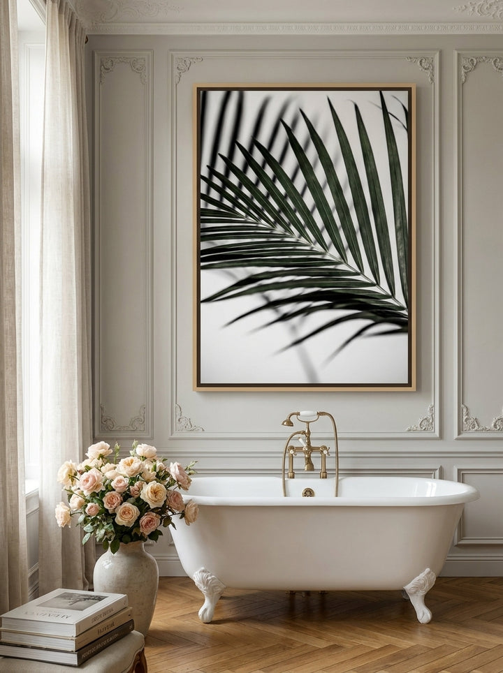 Oversized statement canvas wall art with a natural timber surround styled on the wall in a Parisian bathroom