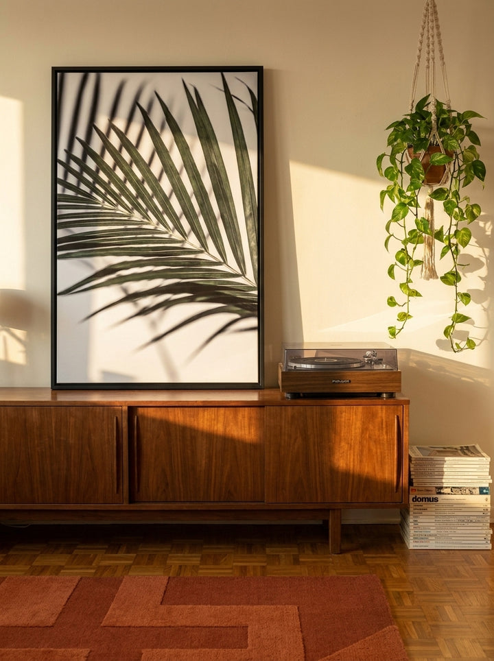 Canvas wall art with a black surround standing on a sideboard in a retro 70s home office