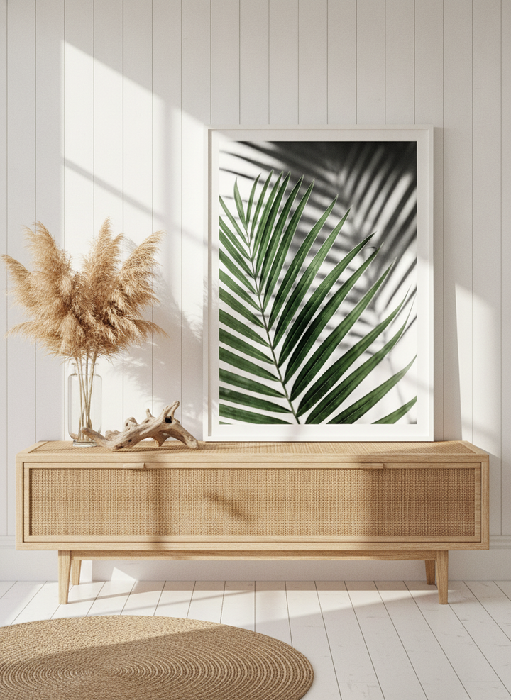 Modern wall art print standing on a sideboard in a coastal bathroom