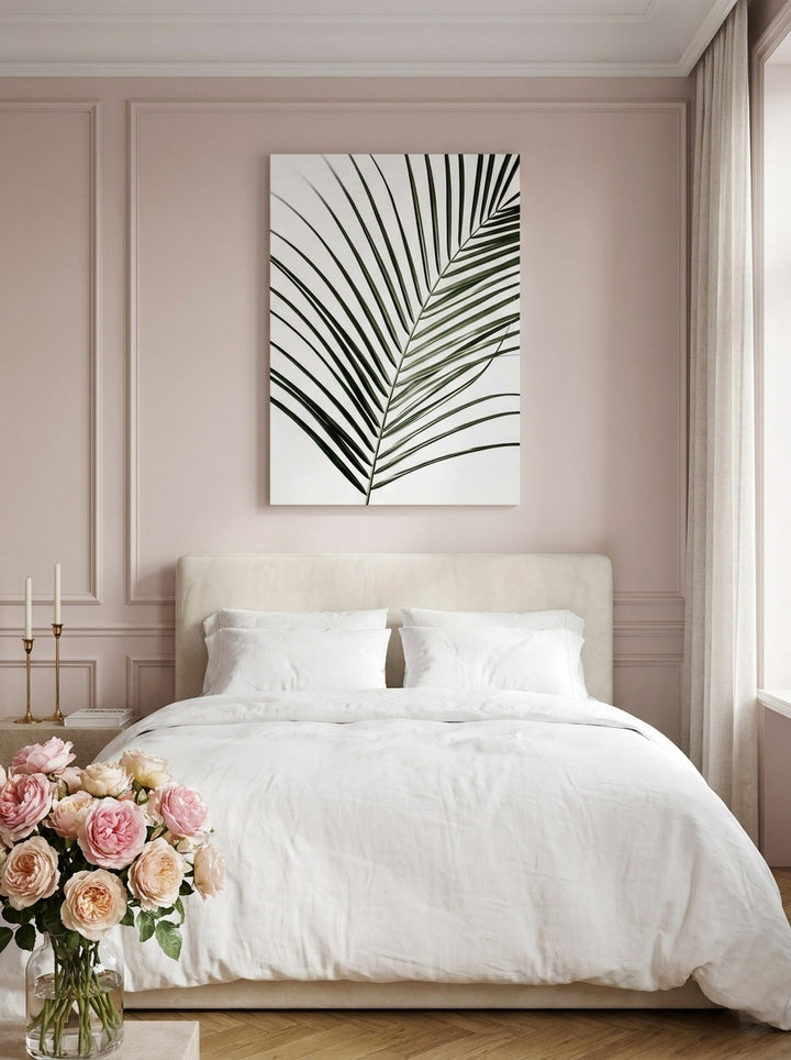 Stretched canvas wall art styled on the wall in a Parisian bedroom