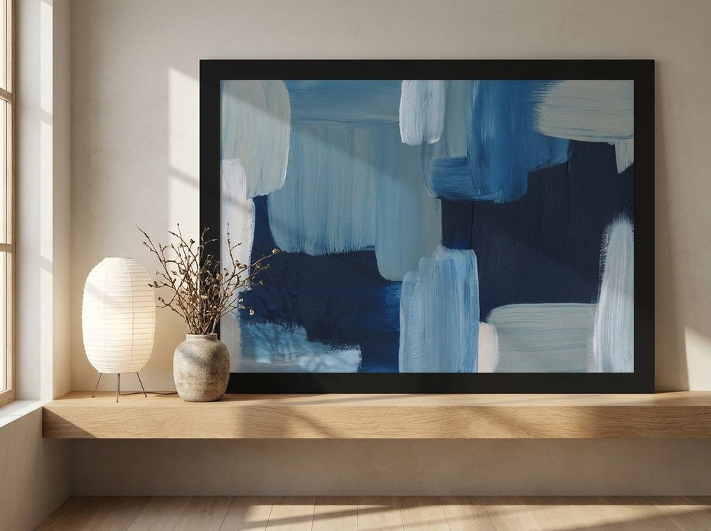 Modern wall art print standing on a shelf in a warm Japandi bedroom