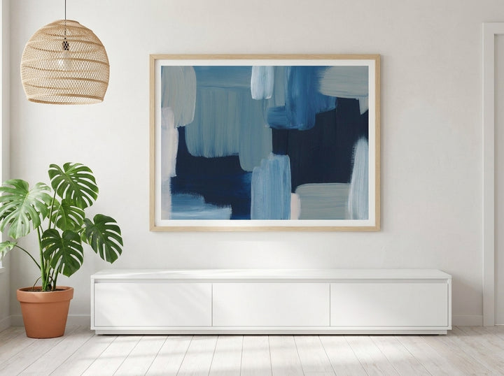 Modern wall art print styled on the wall in a bright Scandinavian living room