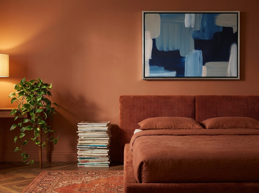 Canvas wall art with a silver leaf surround styled on the wall in a retro 70s bedroom