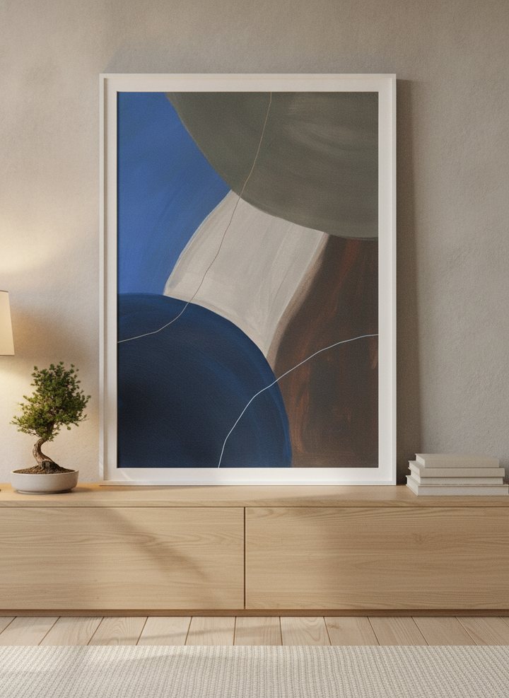 Modern wall art print standing on a sideboard in a warm Japandi bedroom