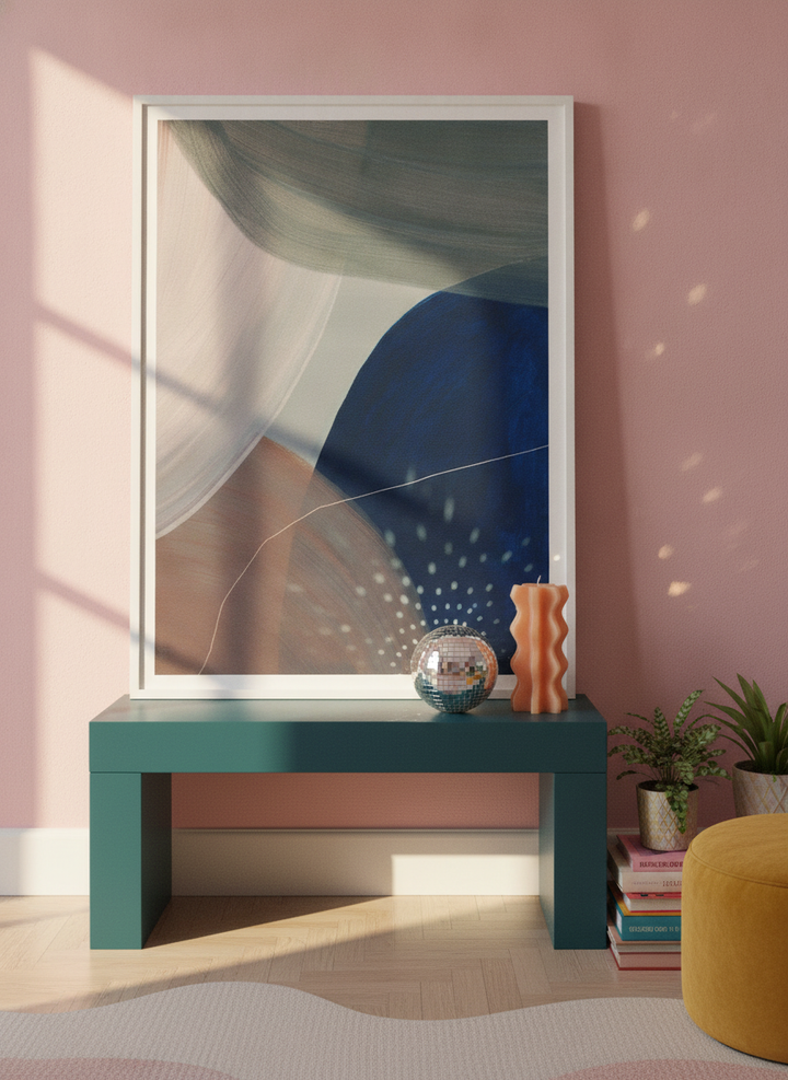 Modern wall art print standing on a side table in a colourful eclectic home office