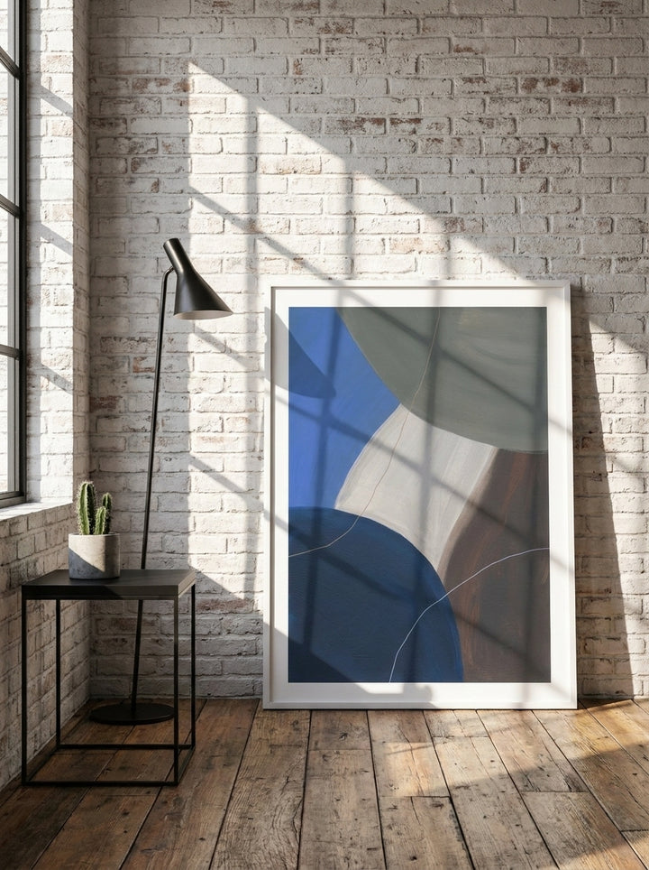 Modern wall art print leaning against the wall in an industrial loft home office