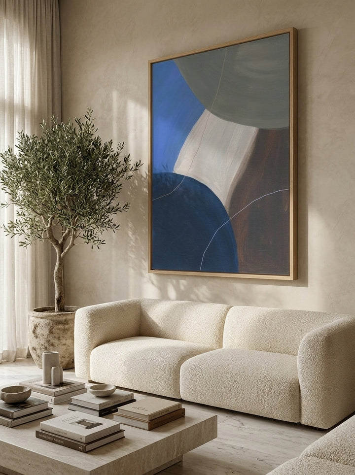 Oversized statement modern wall art print styled on the wall in a luxe living room