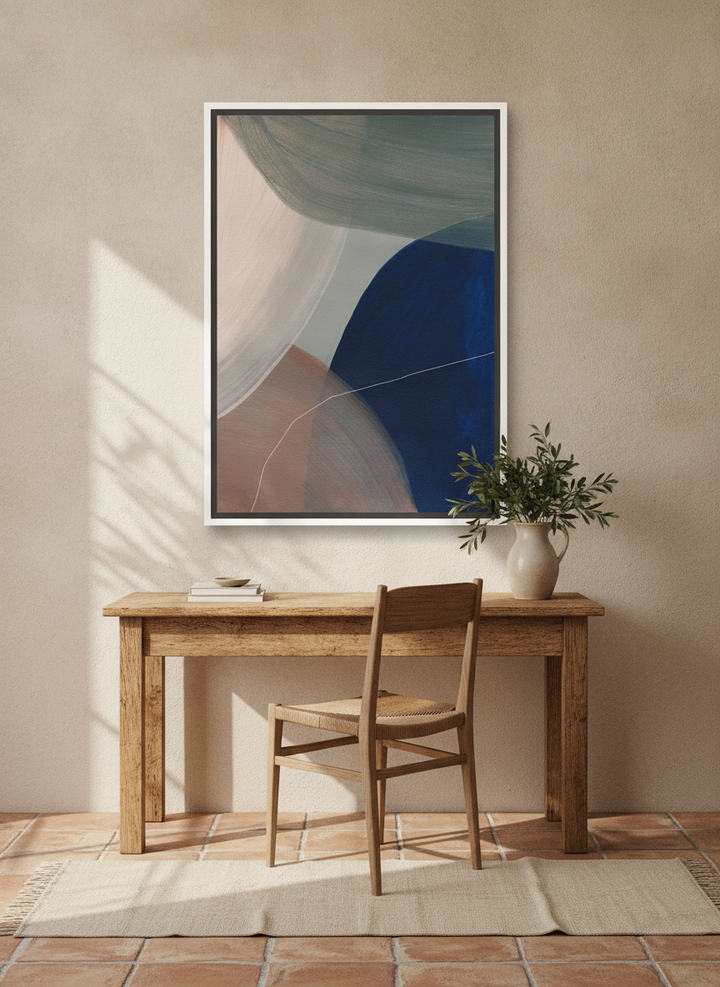 Canvas wall art with a white surround styled on the wall in a Mediterranean home office