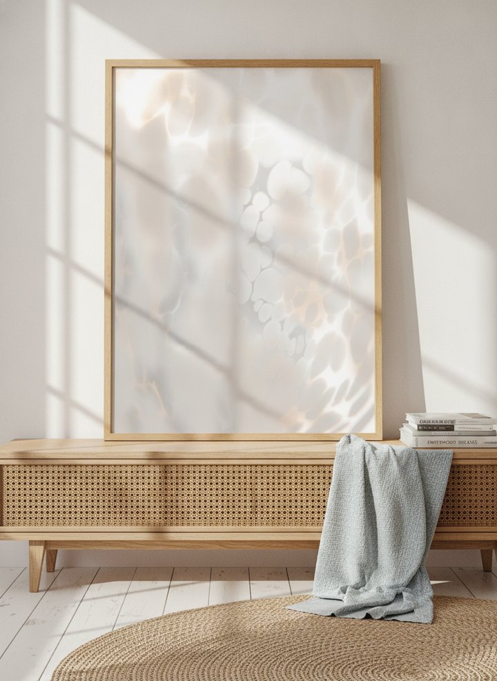 Modern wall art print standing on a sideboard in a coastal home office