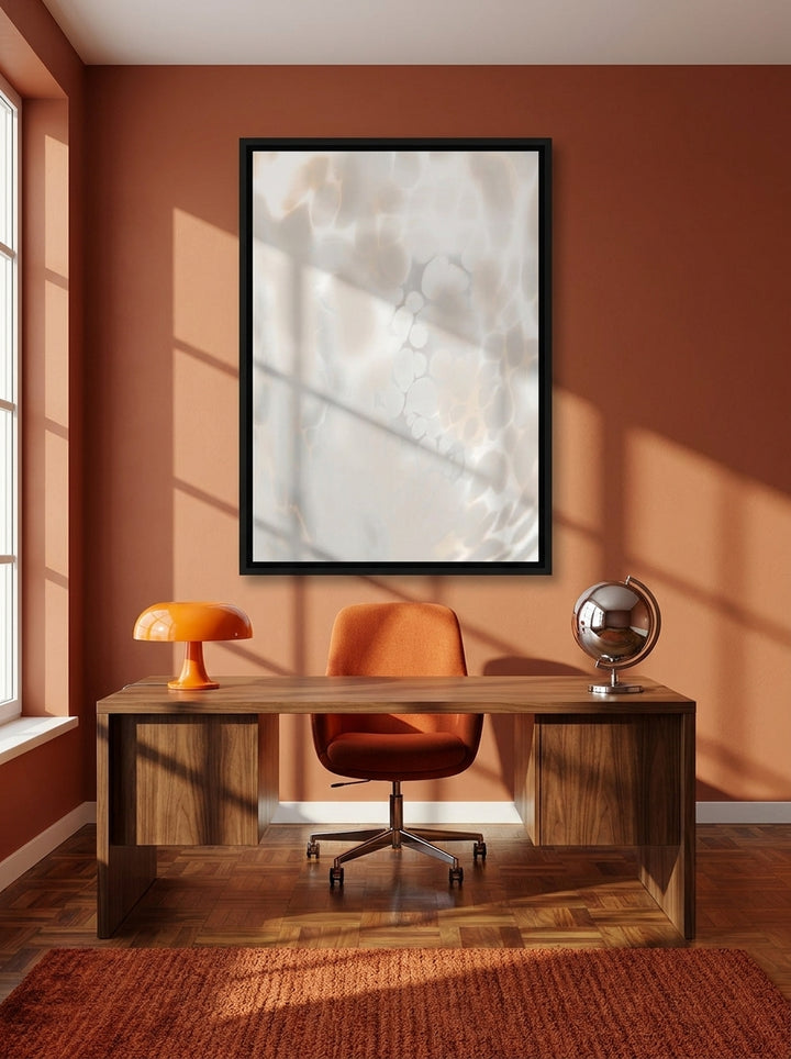 Canvas wall art with a black surround styled on the wall in a retro 70s home office