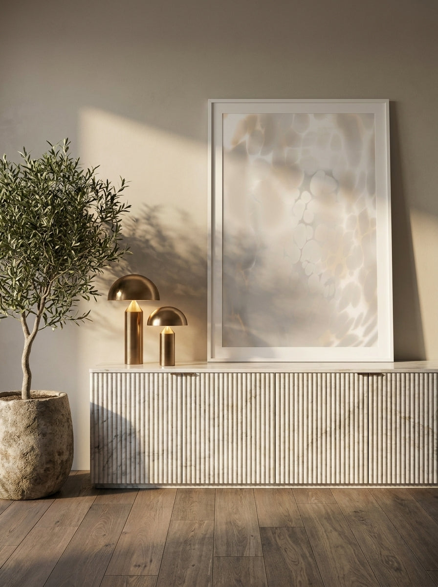 Modern wall art print standing on a sideboard in a luxe bathroom