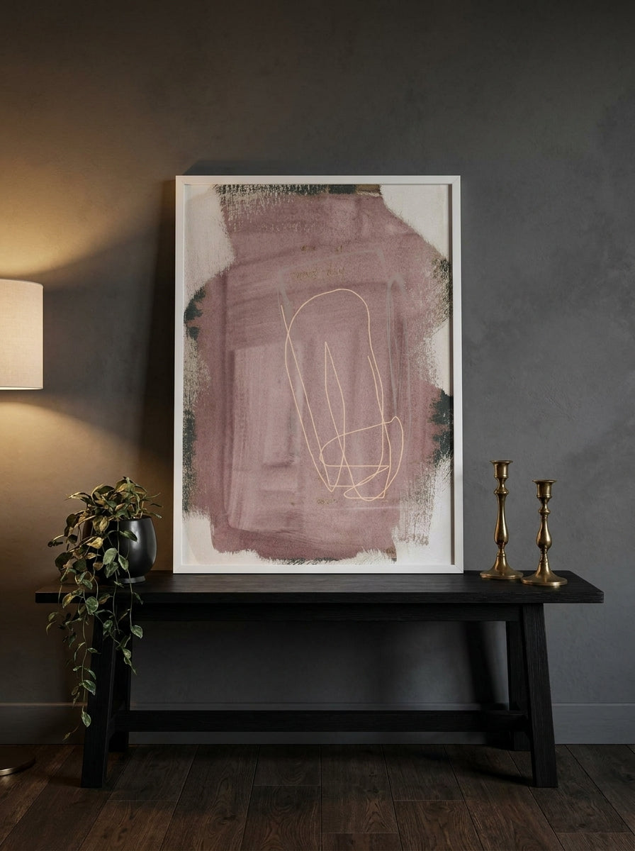 Modern wall art print standing on a console in a moody home office