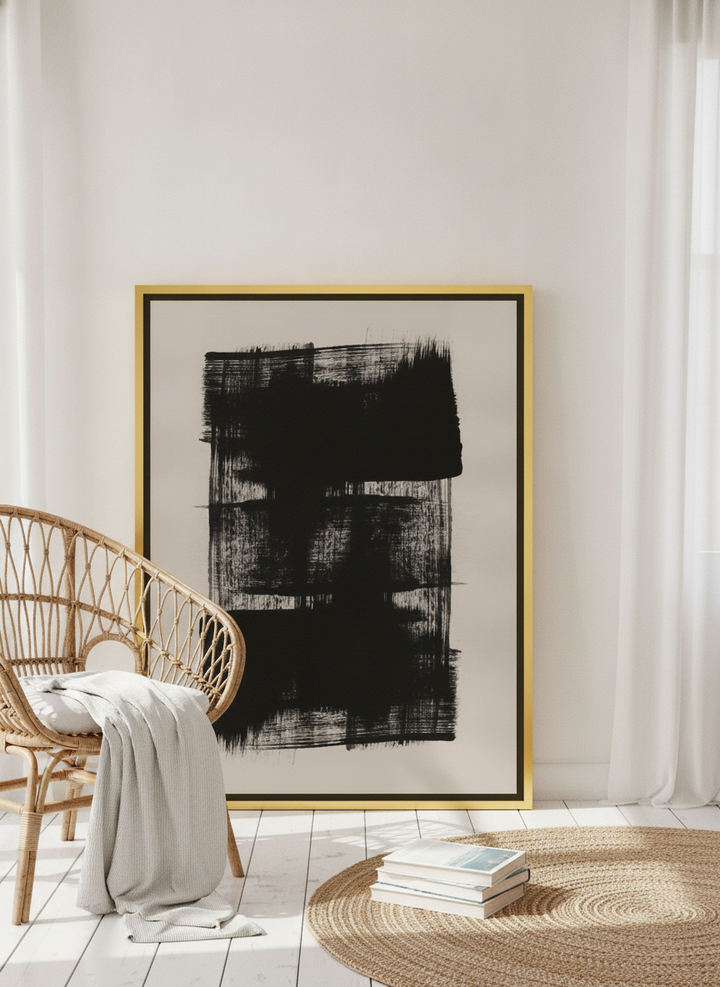 Canvas wall art with a gold leaf surround leaning against the wall in a coastal bedroom