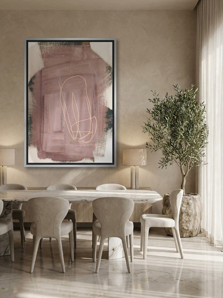 Canvas wall art with a silver leaf surround styled on the wall in a luxe dining room
