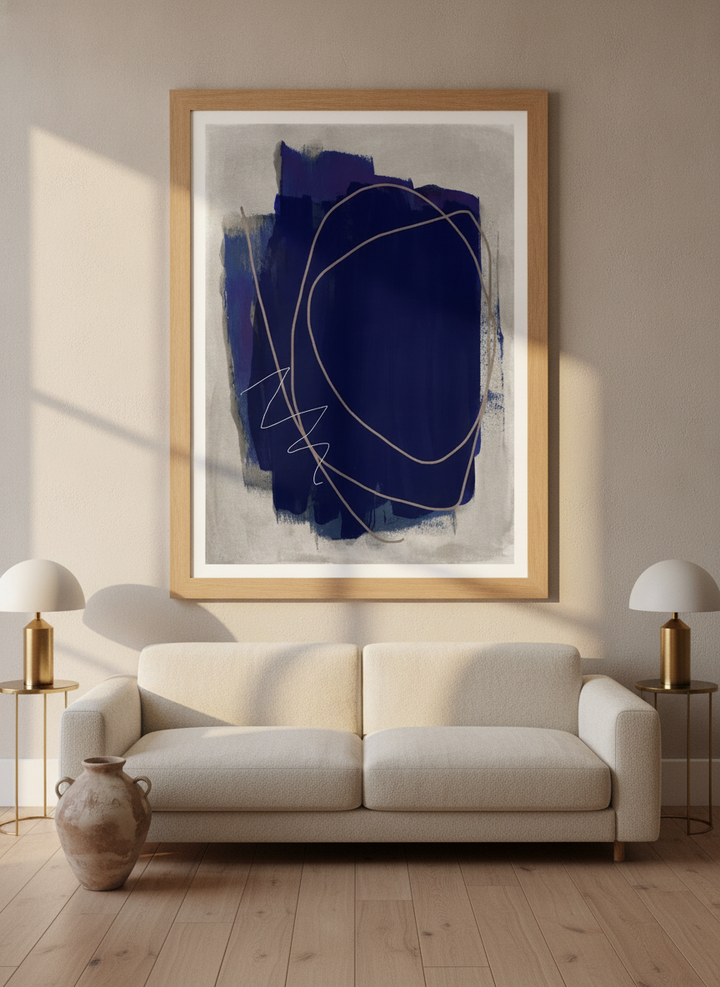 Modern wall art print styled on the wall in a luxe living room