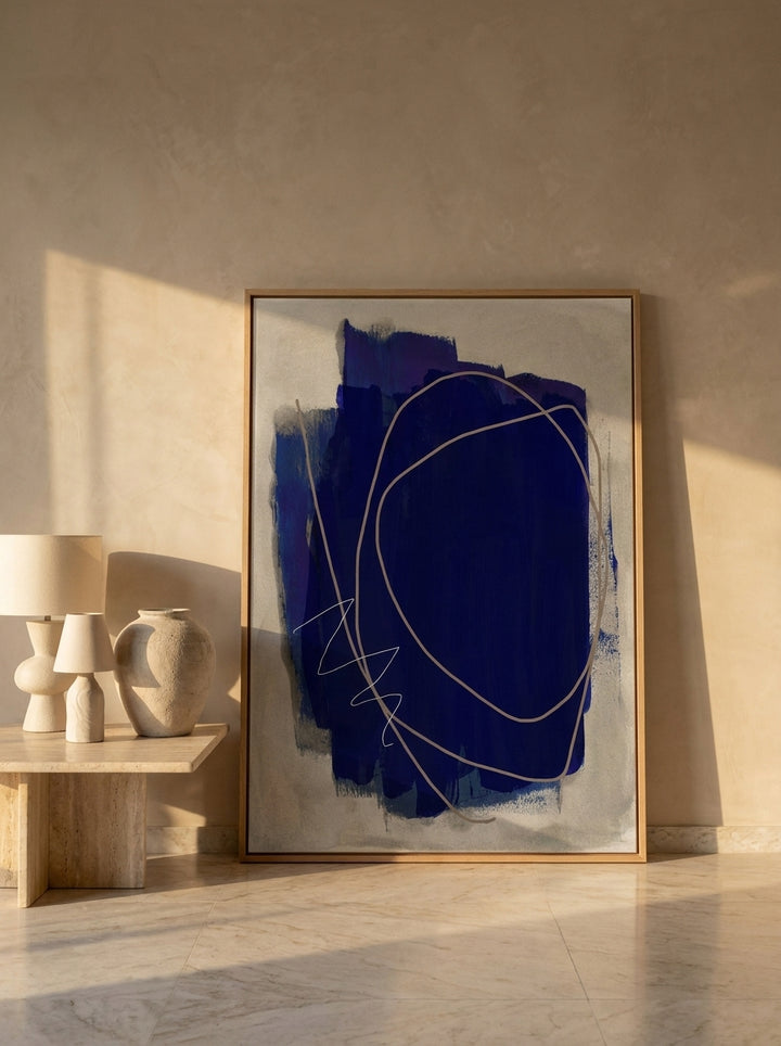 Oversized statement modern wall art print leaning against the wall in a luxe bedroom