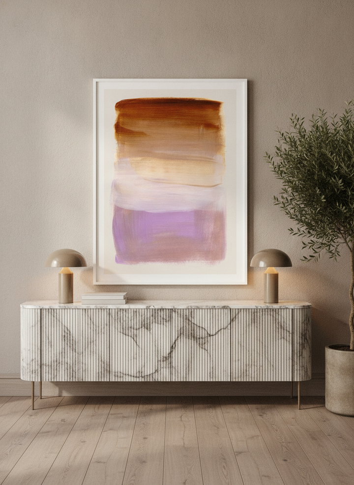Modern wall art print standing on a sideboard in a luxe home office