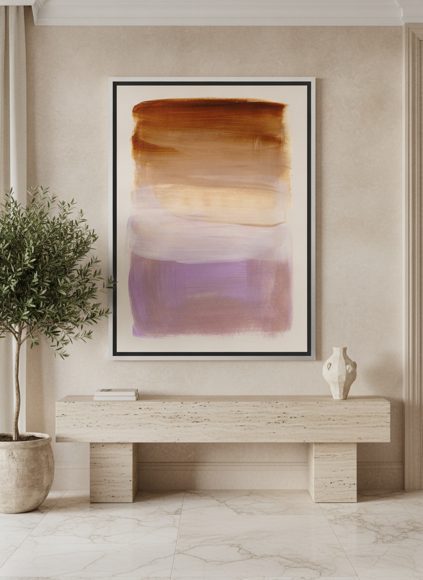 Oversized statement canvas wall art with a silver leaf surround styled on the wall in a luxe living room