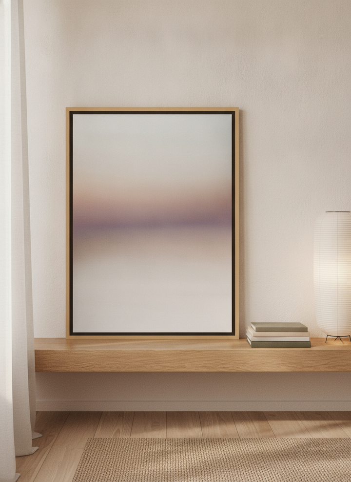 Canvas wall art with a natural timber surround standing on a shelf in a warm Japandi bathroom
