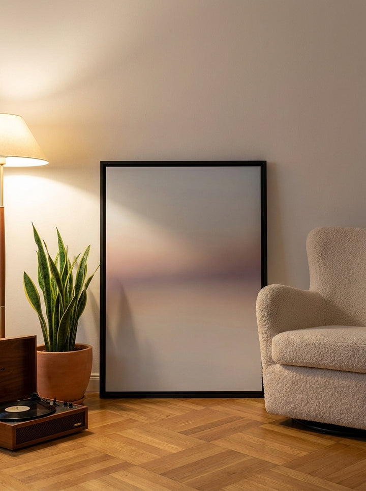 Canvas wall art with a black surround leaning against the wall in a mid-century home office