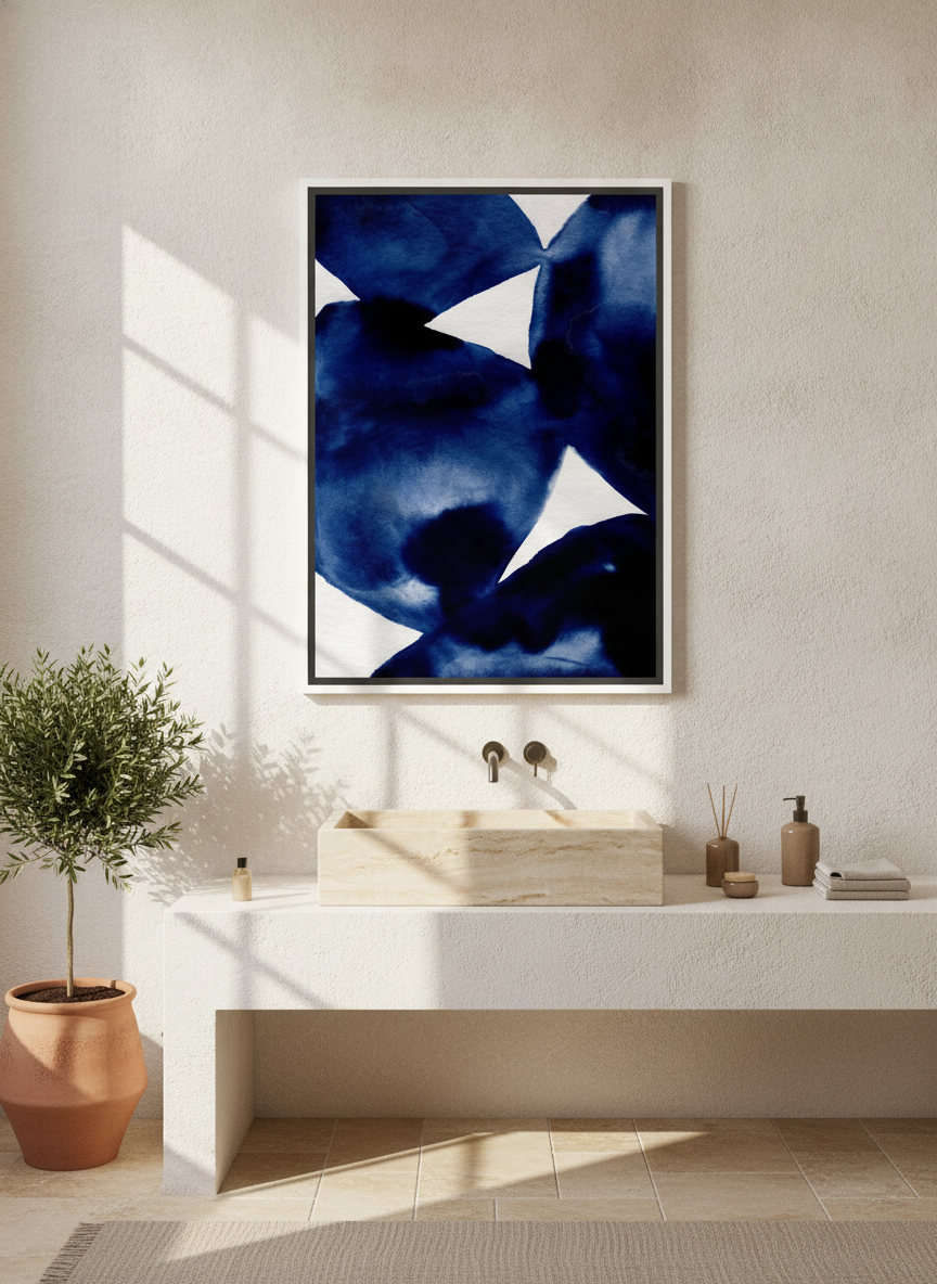 Canvas wall art with a white surround styled on the wall in a Mediterranean bathroom