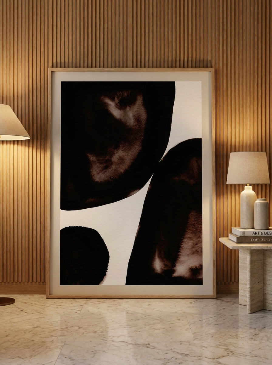 Oversized statement modern wall art print leaning against the wall in a luxe living room