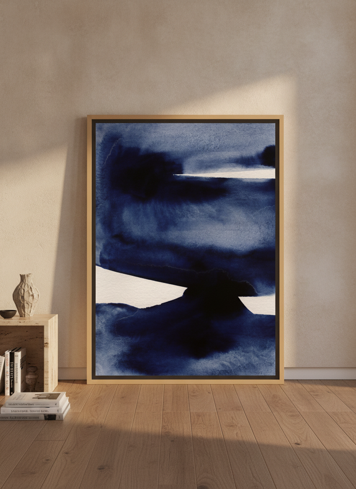 Oversized statement canvas wall art with a natural timber surround leaning against the wall in a luxe bedroom