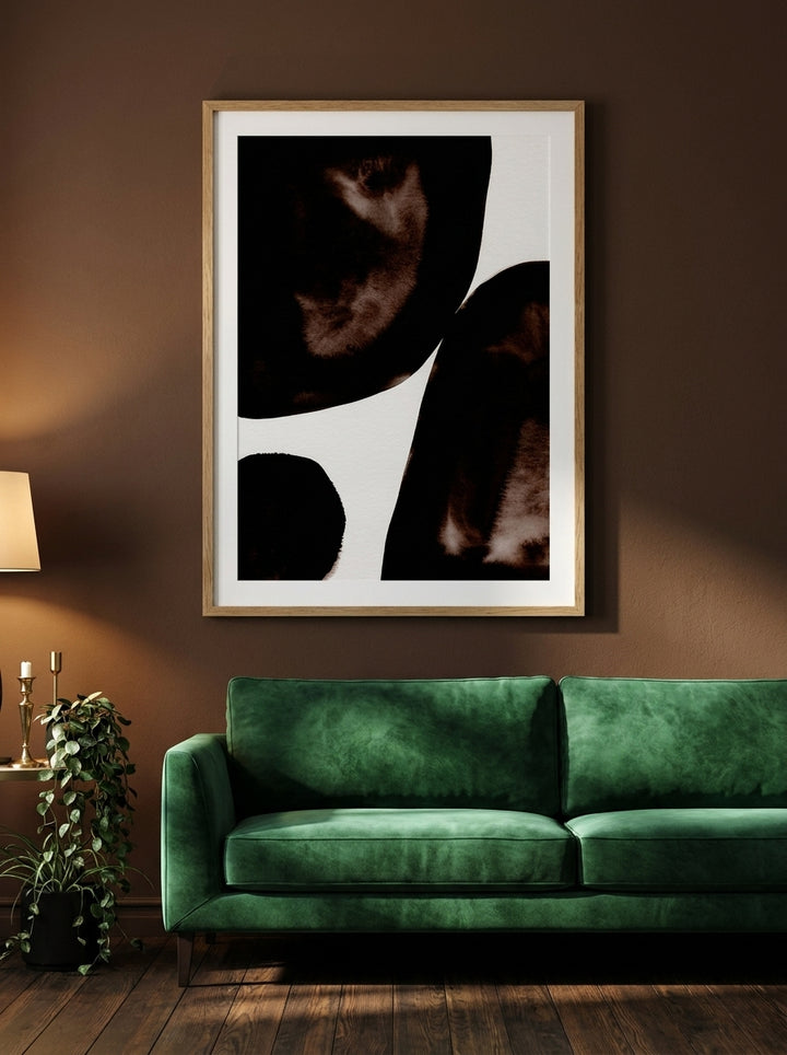 Modern wall art print styled on the wall in a moody living room