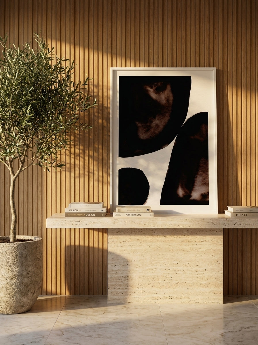 Modern wall art print standing on a console in a luxe bedroom