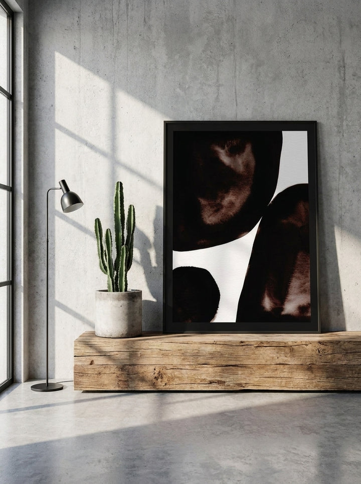 Modern wall art print standing on a bench in an industrial loft home office