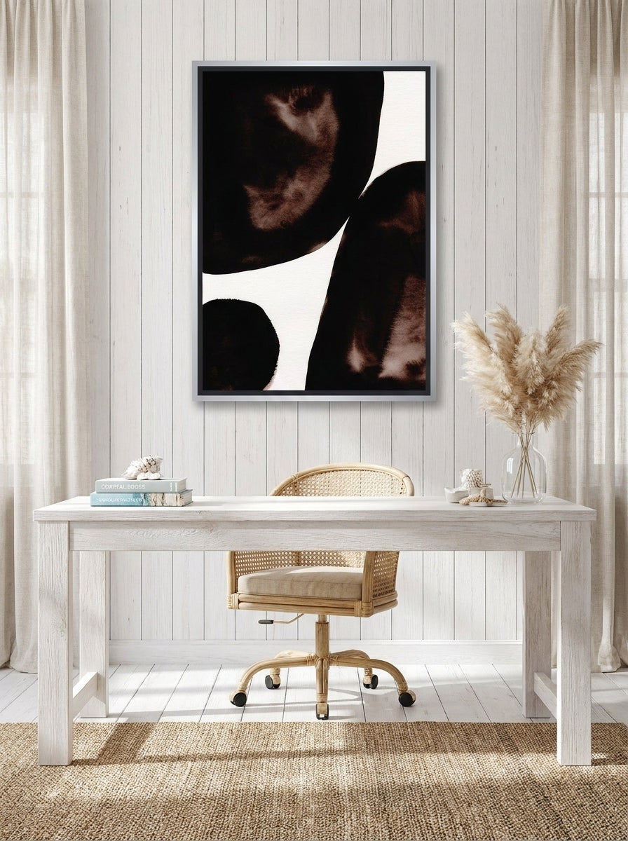 Canvas wall art with a silver leaf surround styled on the wall in a coastal home office