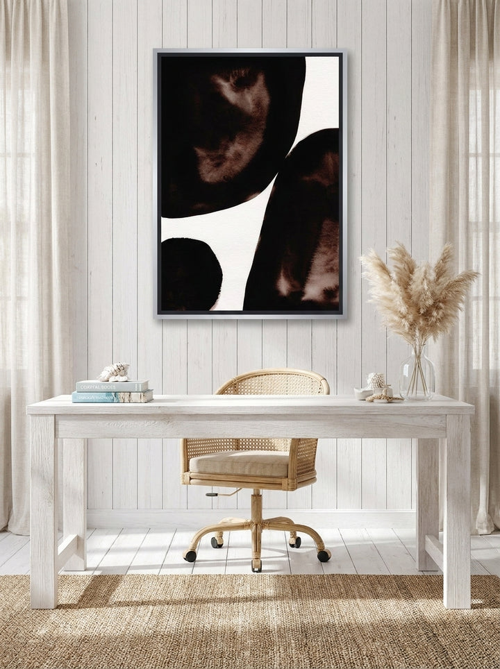 Canvas wall art with a silver leaf surround styled on the wall in a coastal home office