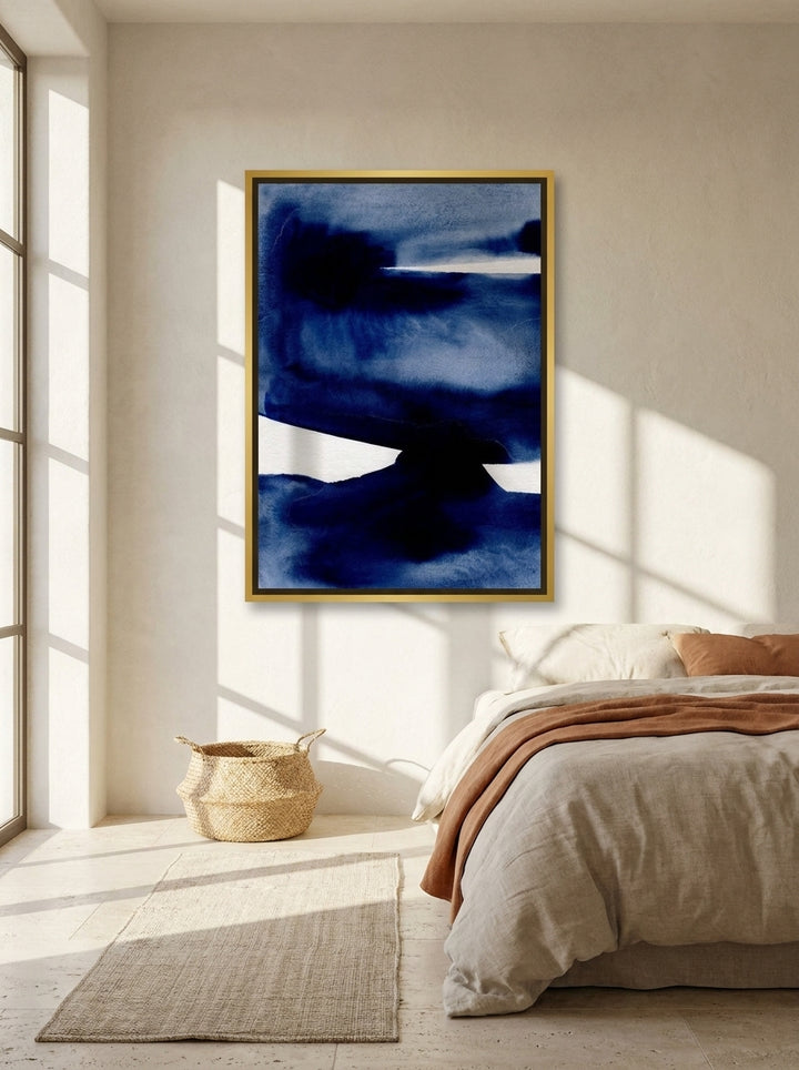 Canvas wall art with a gold leaf surround styled on the wall in a Mediterranean bedroom