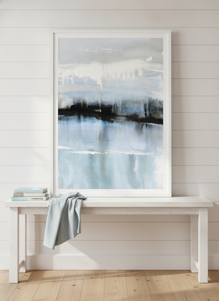Modern wall art print standing on a console in a coastal home office