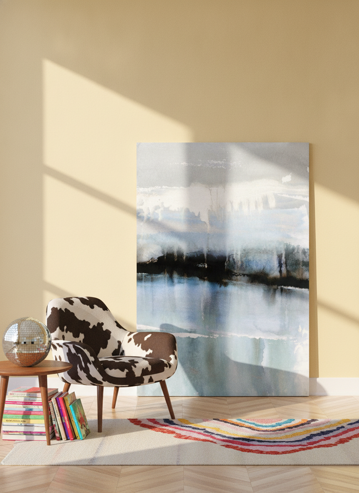 Stretched canvas wall art leaning against the wall in a colourful eclectic home office